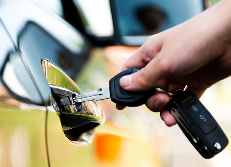 "Close-up image of a professional locksmith from ABC Locksmith Ohio expertly unlocking a car door with specialized tools, highlighting the reliable and efficient car lock service available for Ohio residents."
