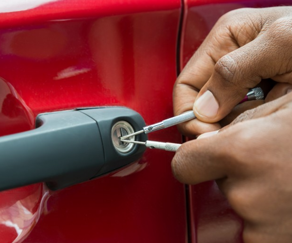 Alt Text: "Professional car locksmith from ABC Locksmith Ohio unlocking a vehicle with specialized tools"